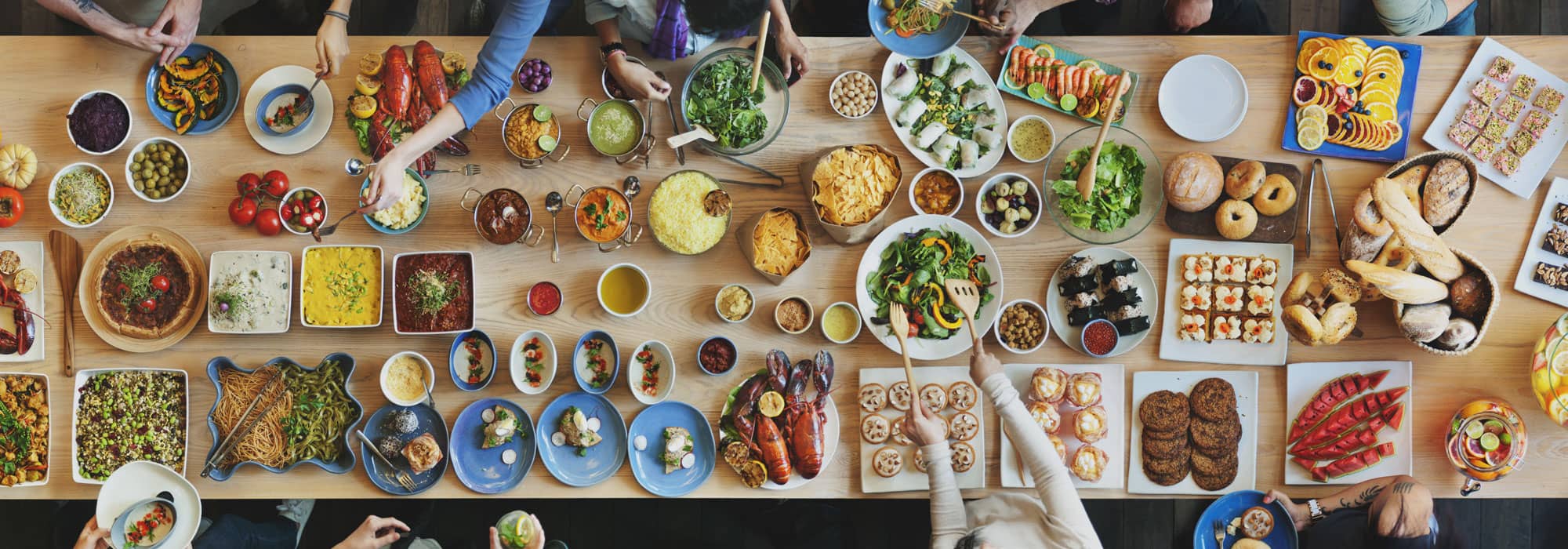 Large family table of health food with fruit and vegetables at Wrexham home