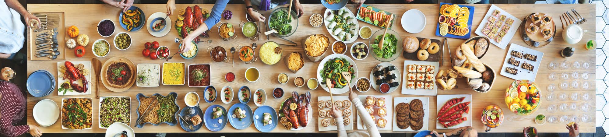 Large family table of health food with fruit and vegetables at Wrexham home